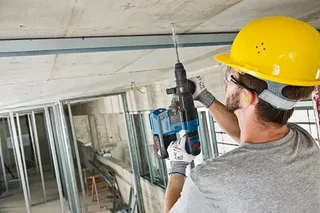 Bosch 18V Tool Set 2 Pieces: GWS 18V-10 P Angle Grinder + GBH 18V-26 Rotary Hammer with 2x 5.5Ah Batteries